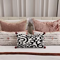 Modern Style Velvet Pillows With Pink Black White Patterns And Tassels On Bed