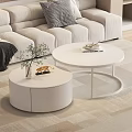 White Round Coffee Table in Living Room with Light Sofa Decorative Plant and Stool