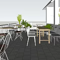 Café Serving Coffee and Milk Tea with Outdoor Seating Green Plants and Umbrellas