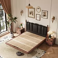 Double Bed with Black Leather Headboard White Floral Sheets and Wooden Nightstand