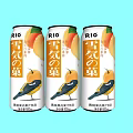 RIO Snowy Fruit Flavored Canned Beverage Three Cans on Light Blue Background