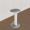 Contemporary Round Accent Table with Polished Metal Frame and Clear Glass Top in Stylish Interior