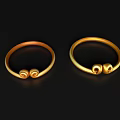 Golden Decorative Ornament Set Featuring Two Rings with Curled Designs