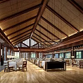 Spacious Restaurant Interior With Wooden Ceiling Hanging Lights Wooden Floor Dining Tables And Chairs