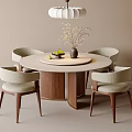 Modern Round Dining Table and Beige Upholstered Chairs Set With Walnut Legs and Decorative Vase