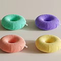 Vibrant Donut Shaped Decorative Pillows in Green Purple Pink Yellow Tones