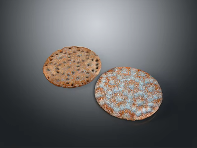 Two Round Brown And White Patterned Food Items With Holes On Surface 3d model