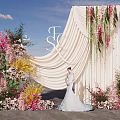 Wedding Photo Spot With Beige Drape Floral Decor And Bride In White Dress