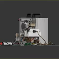 Laboratory Equipment Setup on Green Mat with Tools Wires and Small Metal Components