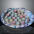Colorful Marshmallows Arranged in Blue and White Patterned Plate on Dark Surface