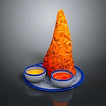 Orange Cone Shaped Food On Blue Tray With Yellow And Red Sauce Bowls