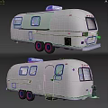 Shiny Silver Vintage Trailer With Shiny Exterior Red Wheels And Classic Design