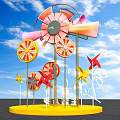 Colorful Windmill Sculpture with Long Live Life Lettering and Blue Sky