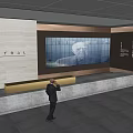 Modern Central Reception Desk With Large Digital Screen And Staff Standing Nearby