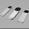 Three Modern White Electronic Remote Controls With Display Screens And Buttons