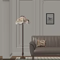 Decorative Floor Lamp with Intricate Shade and Brown Sofa with Geometric Pillow