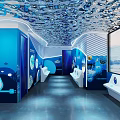 Underwater Oceanarium Tunnel With Colorful Fish Coral Large Aquarium Tanks Rock Decorations And Soft Lighting