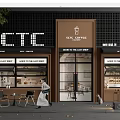 SCTC Coffee Shop Storefront with Illuminated Sign Glass Doors Outdoor Seating and People Walking By