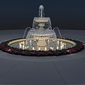 Ornamental Multi Tiered Water Fountain With Circular Flower Bed And Illuminated Lights
