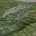 Detailed Mountain Terrain Aerial View With Lush Green Vegetation And Rolling Valleys