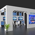 Modern Event Exhibition Wall with Cultural Display Screens Tables Chairs and Green Plant