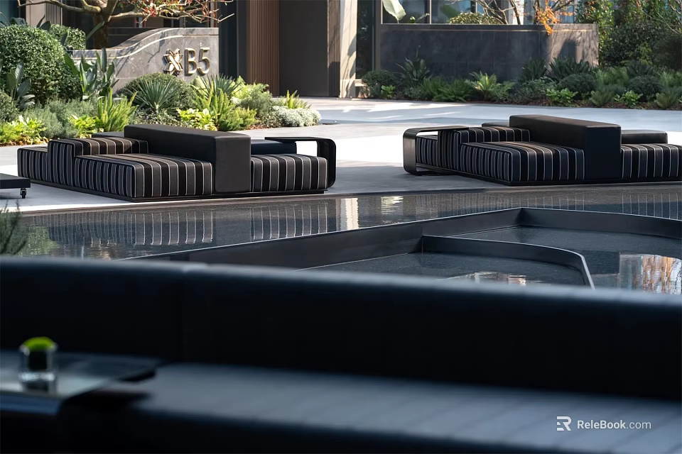 Black Outdoor Sofa Set In Modern Patio With Lush Greenery And Water Feature 3d model 