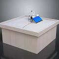 White Cube Shaped Computer Case With Blue Solar Panel And Devices On Top Surface