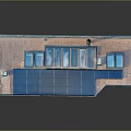 Red Brick Building Exterior With Blue Garage Door And Multiple Glass Windows