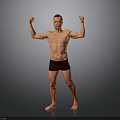 Shirtless Man in Black Shorts Raising Arms to Showcase Muscles on Gray Background
