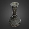 Antique Carved Metal Vase With Intricate Floral Patterns And Ornate Design
