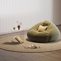 Cozy Living Area With Green Bean Bag Chair Round Rug Books And Wooden Floor