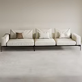 Beige Sectional Sofa With Multiple Cushions Black Metal Legs Light Colored Walls Gray Floor
