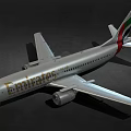 Emirates Passenger Airplane With Silver Body And Branding On Dark Background