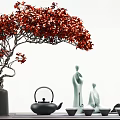 Ornament Decor Combination With Red Flowering Tree Green Figurines Black Teapot And Wooden Table