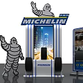 Michelin Display Stand Featuring Waving Michelin Man And Race Track Design