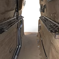 Industrial Rock Wall With Metal Ladders Pipes And Cables