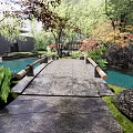 Rockery Stones In Serene Pool With Tree Reflections And Greenery