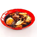 Delicious Dark Soup With Sliced Meat Half Marinated Egg And Croutons In Red Bowl