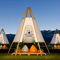 Sun Camping Site With Teepee Tents Wooden Frames Green Grassland And Mountain Backdrop
