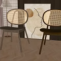 Modern Dining Chairs With Rattan Backrest And Wooden Legs In Interior With Abstract Painting