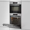 Modern Kitchen Appliances Featuring Stainless Steel Refrigerator Built-in Ovens And Gas Cooktop