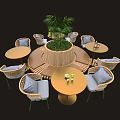 Round Outdoor Tables with Rattan Chairs Gray Cushions Surrounding Central Green Plant and Drinks