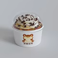 Delicious Cupcake With Cream Topping Chocolate Chips And Bear Pattern On White Paper Cup