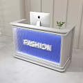 Modern Fashion Reception Desk With Computer And Arched Background Wall Design