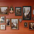 Orange Wall Decorated With Various Framed Paintings Mirrors And Ornate Decorative Items