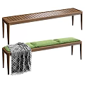Wooden Chaise Lounge With Green Cushions And Black White Checkered Blanket