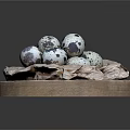 Fresh Small Quail Eggs Neatly Arranged on Wooden Plate with Parchment Paper