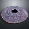 Intricately Carved Circular Sculpture Artwork With Central Hole and Ornate Decorative Patterns