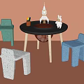 Kids Table with Green Blue White Chairs Pencils and Toys on Orange Background