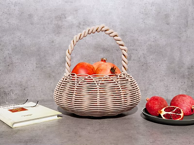 Wicker Basket With Pomegranates Open Book Eyeglasses And Plate With Sliced Pomegranate 3d model